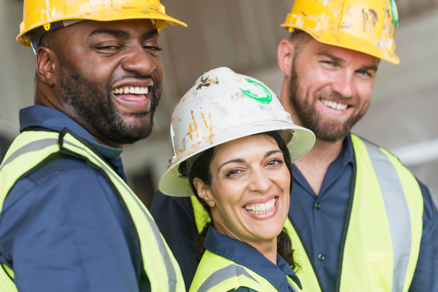 Woman with diverse group of construction workers